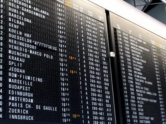 My PA Online virtual assistant UK travel arrangement service image of an airport flight departure board.